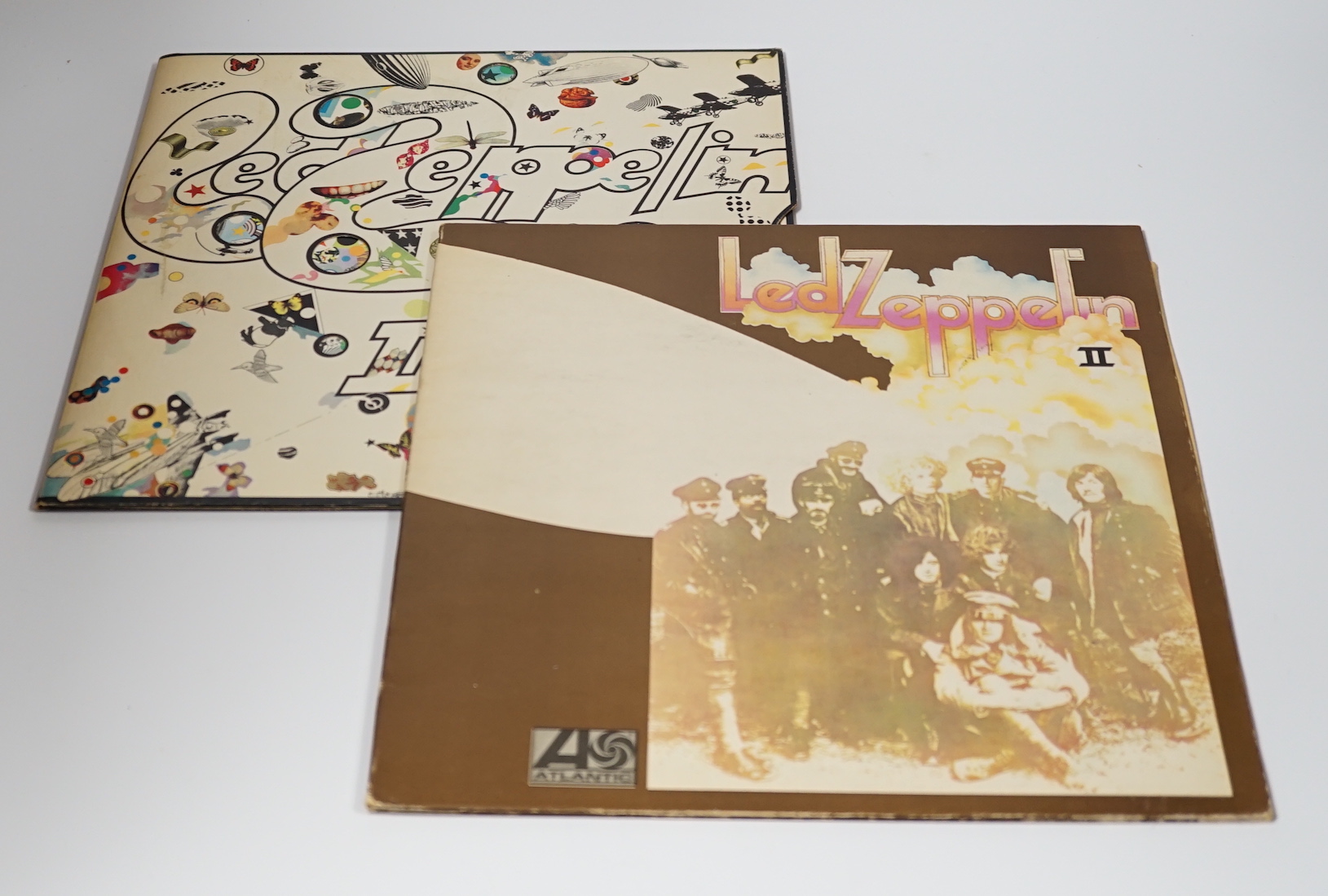 Two Led Zeppelin, LP record albums; Led Zeppelin II, on red and maroon Atlantic label, (588198), and Led Zeppelin III, on red and maroon Atlantic label, (2401–002)